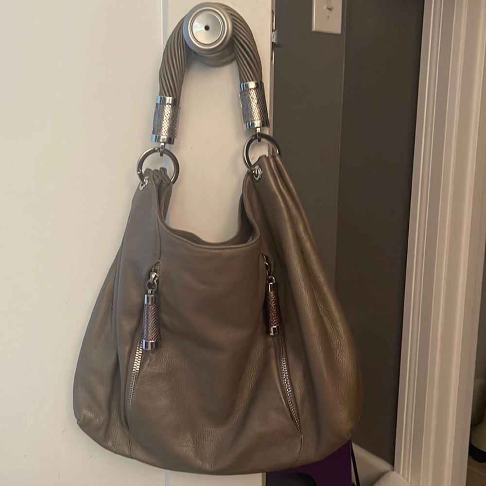Sterling silver hardware with genuine python details .. excellent condition